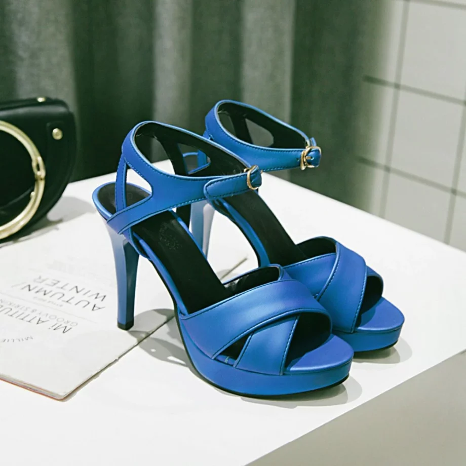 navy blue sandal pairs on the bathroom sink